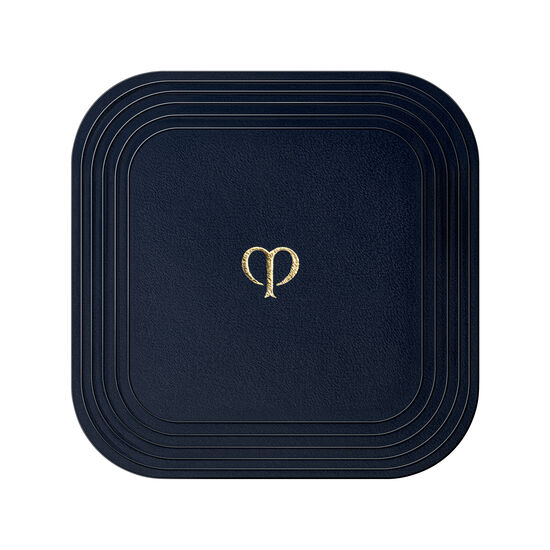 Houppette pour poudre compacte correctrice